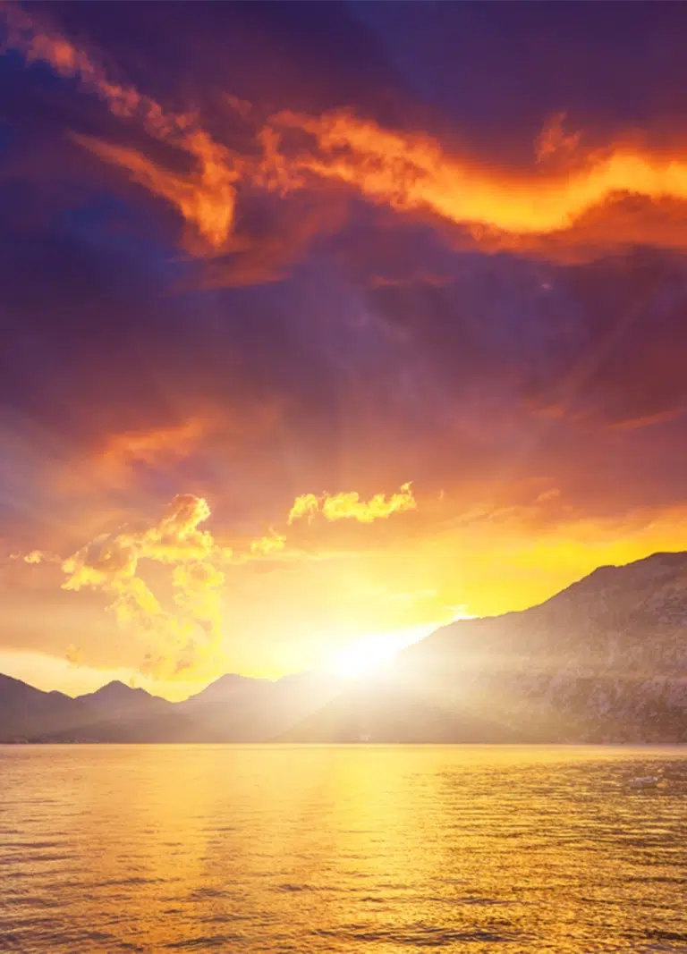 Sunsetsun over the mountains and a lake. Be in front of NDIS Participants when they are searching for support services with Advanced NDIS PPC that works!